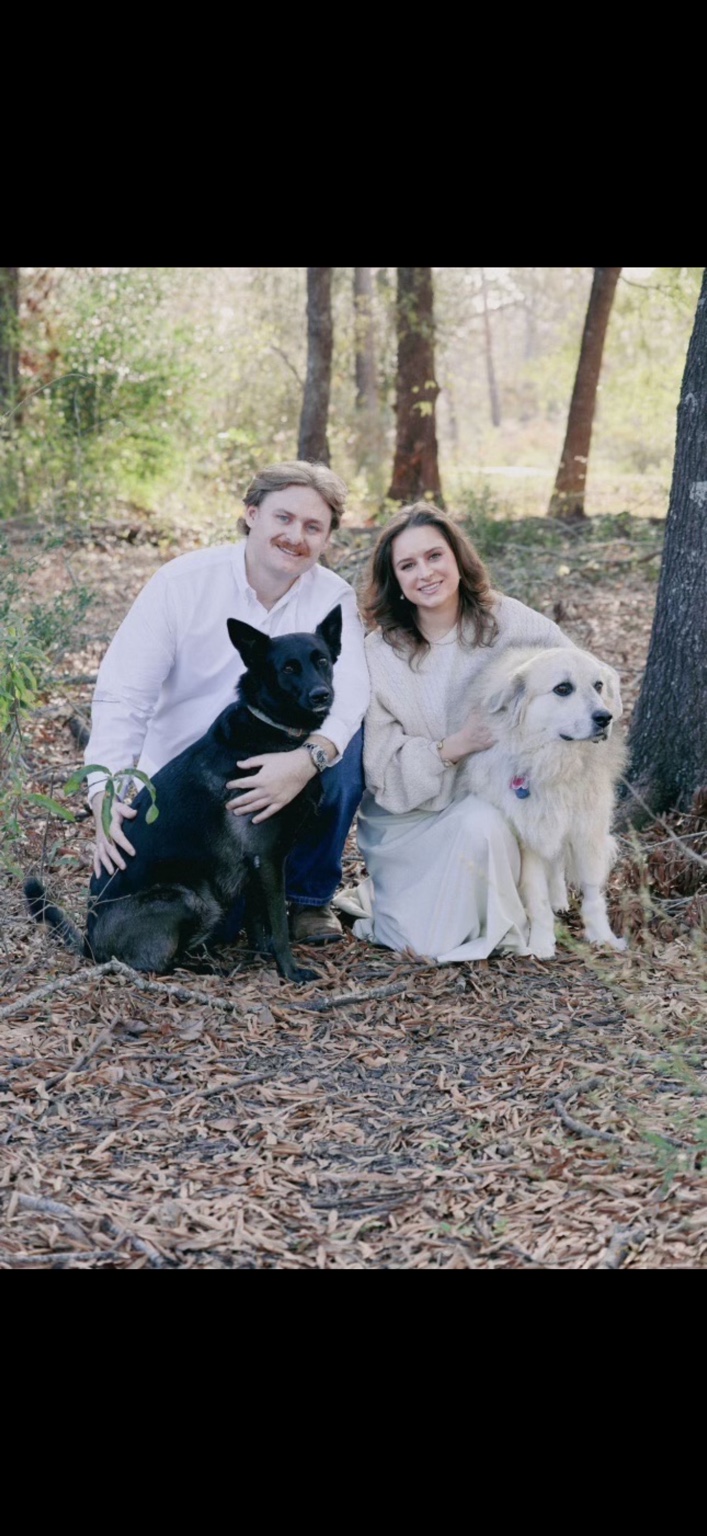 Carson Patrick with his fiancée and their two dogs outdoors
